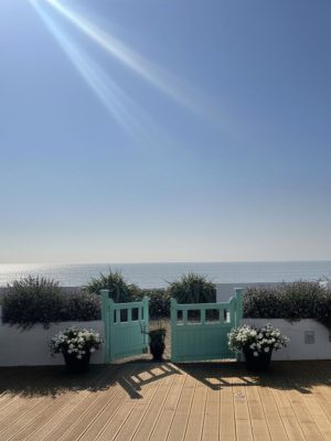 Beach house with outdoor decking and sea view