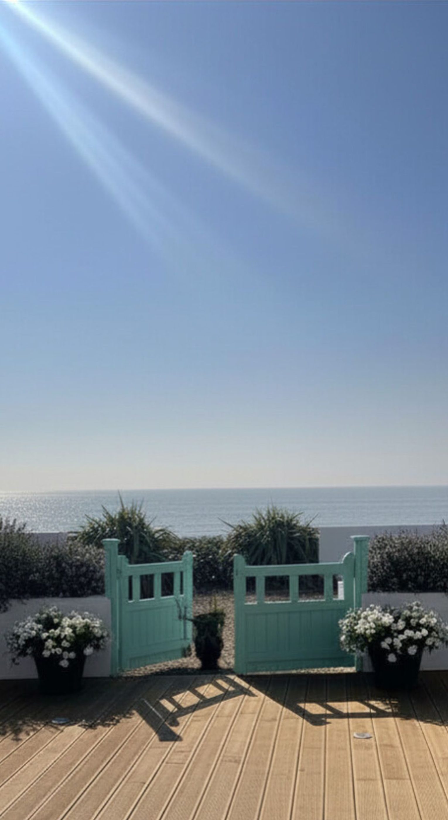 Beach house with outdoor decking and sea view